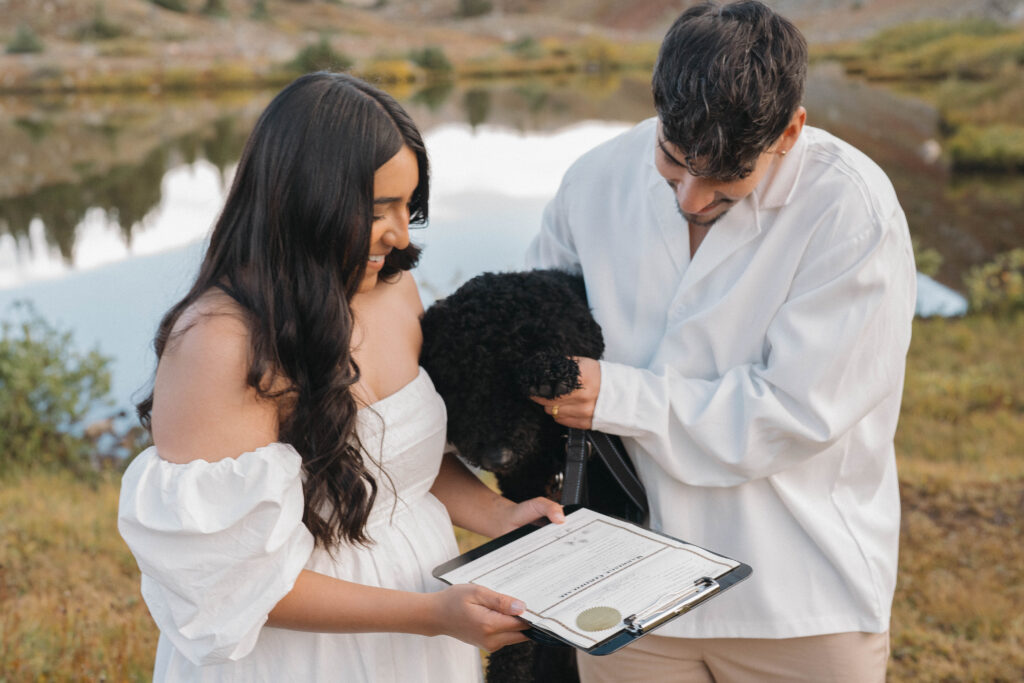 Couple signing their Colorado marriage license at Loveland Pass