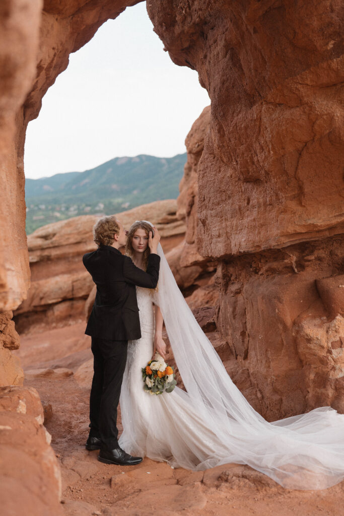 Bride and groom walking through Garden of the Gods after their ceremony