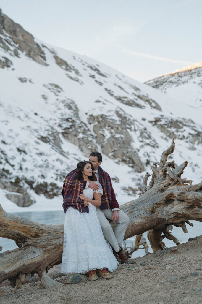 Bride and groom hiking to St. Mary's Glacier for their Colorado elopement