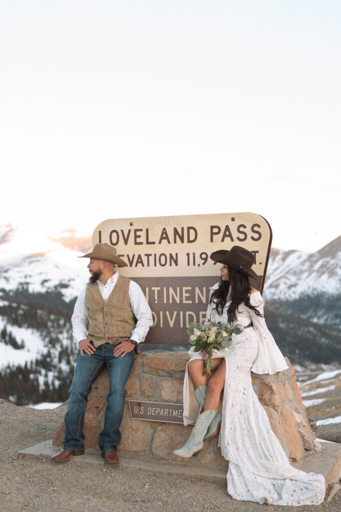 Bride and groom celebrating their Loveland Pass elopement with mountain views.