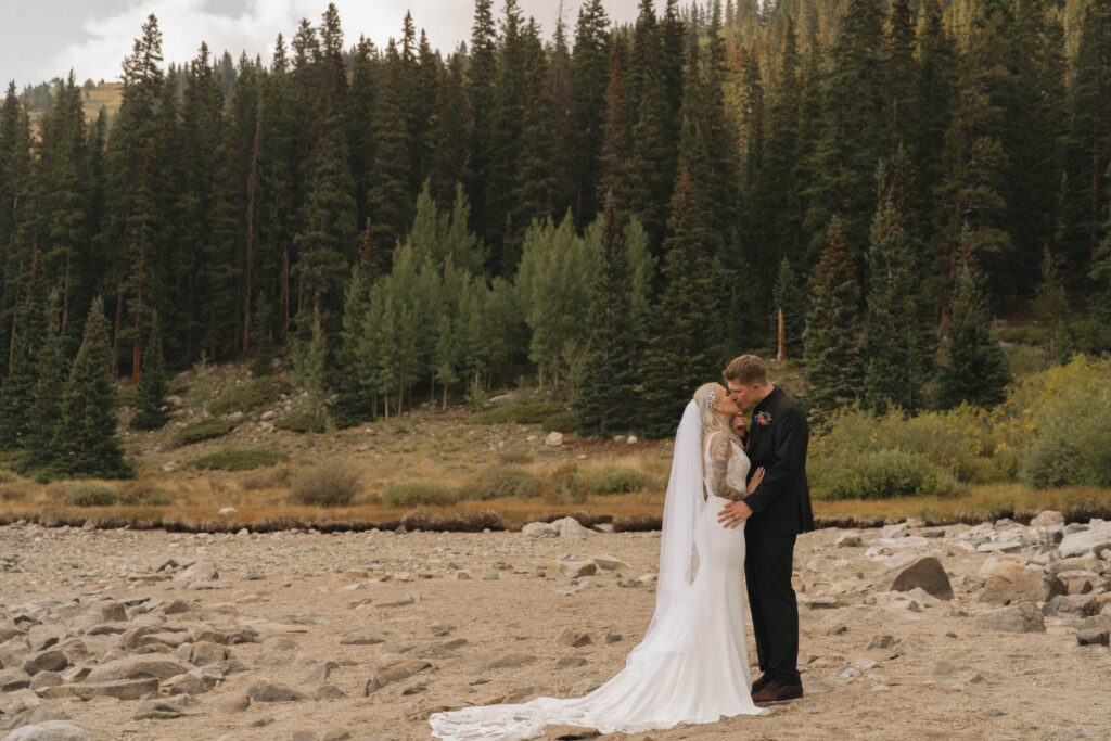 Bride and groom surrounded by golden aspens during their Breckenridge fall elopement.