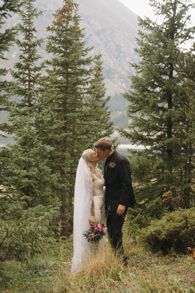 Couple embracing during their Breckenridge fall elopement